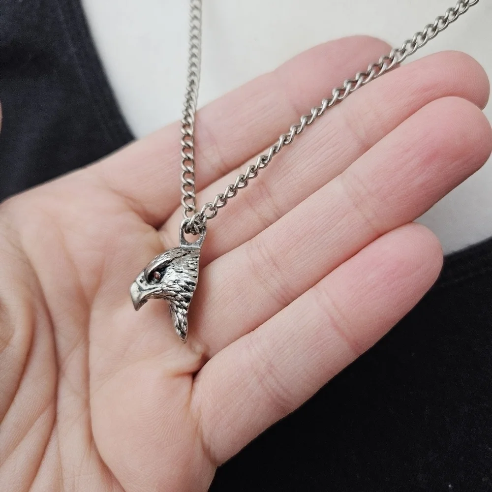 silver tone chain with eagle head pendant